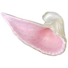 a pink and white flower shaped object on a white background