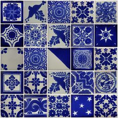 blue and white tiles with different designs on them