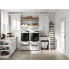 a washer and dryer in a white kitchen