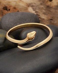 Bronze Snake Ring | The Life Divine Bronze simple adjustable snake ring is slender and dainty, appealing to those with the most delicate tastes.Snakes represent fertility or a creative life force. As snakes shed their skin through sloughing, they are symbols of rebirth, transformation, immortality, and healing. Serpent reminds us to shed our past and old stories the way she sheds her skin, to walk gently and humbly on Mother Earth. The ouroboros is a symbol of eternity and continual renewal of l Super Attractor, Snake Shedding, Motivational Jewelry, Serpent Ring, Snake Ring Silver, She Sheds, Snake Ring, Life Force, Oracle Cards