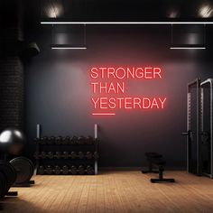 there is a neon sign that says,'stronger than yesterday '