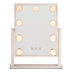 a lighted vanity mirror with four lights on it's sides and three bulbs in the middle