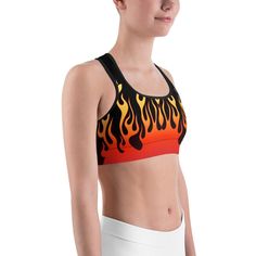 Phwar, Hot Dang, the Gearbunch Flame Sports Bra 
Make a statement & maybe move a little faster in this bold black sports bra with rising red, orange and yellow flames.
This gorgeous sports bra is made from moisture-wicking material that stays dry during low and medium intensity workouts. The bra has support material in the shoulder straps, double layer front, and a wide elastic band to ensure constant support.

Wear to yoga, the gym, or wherever makes you feel good.
Be Happy, Be Bright, Be Y Functional Orange Sports Bra For Training, Orange Activewear For Sports, Red Racerback Sports Bra For Gym, Breathable Orange Activewear For Sports, Red Racerback Sports Bra For Workout, Fitted Orange Sports Bra For Gym, Functional Orange Sports Bra For Workout, Orange Sporty Sports Bra For Gym, Orange Athleisure Sports Bra For Workout