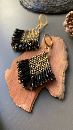 Artisan Gold Beaded Earrings, Gold Artisan Beaded Earrings With Dangling Beads, Bohemian Gold Rectangular Beaded Earrings, Artisan Adjustable Gold Beaded Earrings, Gold Bohemian Beaded Earrings For Gift, Gold Beaded Earrings With Black Beads As Gift, Artisan Gold Earrings With Dangling Beads, Rectangular Gold Beaded Jewelry, Artisan Earrings With Black Beads As Gift