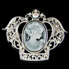 "PERFECT CHRISTMAS / VALENTINE / MOTHER'S DAY GIFT !! PERFECT GIFT /WEDDING GIFT FOR BRIDE / BRIDESMAID / LADY! This Classy Black Cameo Crown pin /brooch measuring 2 1/8\" wide X 1 5/8\" high (53mm X 42mm), inlayed with a lot of Swarovski crystals. Crystal Color: Aurora Borealis, Crystal Clear It goes well with modern as well as vintage styling...it really depends how you want to wear it. Great piece for your collection! Prices are in US$. For shipping policies and other important information, c White Cameo Brooch For Wedding, White Cameo Brooches For Wedding, White Cameo Wedding Brooches, Elegant Silver Brooch For Christmas, Elegant Christmas Brooches For Formal Occasions, Cameo Brooches For Wedding, Victorian Silver Wedding Brooches, Victorian White Wedding Brooches, Ornate White Brooches For Wedding