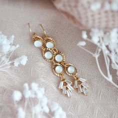 "Boho Wedding Earrings // Bridal Statement Earrings // 14k Gold Filled Earrings Gorgeous glowing opalite stones and dainty cubic zirconia fans secured to delicate 14k gold filled earring wires. These long and beautiful statement earrings are the perfect accessory for your special day or your bridesmaids. All of my jewelry arrives suitably gift wrapped ready for gift giving. For hygienic reasons I don't accept returns or exchanges on earrings. Measurements: The bridal statement earrings hang appr Boho Bridal Earrings, Wedding Jewelry Crystal, Boho Bridal Jewelry, Boho Wedding Earrings, Opalite Necklace, Bridal Statement Earrings, Gold Bridal Necklace, Bling Wedding, Earring Wires