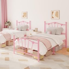 two twin beds with pink headboards and foot boards in a white walled bedroom area