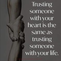 two hands holding each other with the words trust and trust