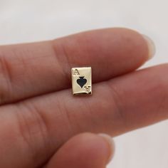 Unique Ace of Spades earrings, quirky playing card stud earrings made in 14k solid gold and black enamel * Stud size: 7x5mm * Material: 14K Solid Yellow Gold. * Sold as One pair.  * Solid gold backings included. ❤️Visit our official website for exclusive new products.      https://elekalonjewelry.com/ ❤️Follow us on Instagram @ elekalonjewelry for the latest projects and much more! ❤️If you have any questions, please feel free to message us. Nerd Earrings, Game Earrings, Card Earrings, Poker Card, Dainty Studs, Earrings Dainty, Earrings Unique, Playing Card, Black Enamel