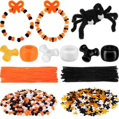 various halloween decorations and accessories are arranged on a white background with black, orange, and white beads