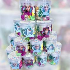 there are many plastic containers with princesses on them