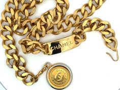 Classic and chic, this vintage Chanel chain belt is crafted in gold-plated metal, accented with a 'CC' logo-engraved medallion pendant. Closure can be hooked on multiple links for a variety of fits.Brooch Specifications:Designer: CHANELFits Waist Size Up To: 31"Coin Measurements: ~1.25" Stamped: "CHANEL "Made in France"Condition: PreownedGold Plated Luxury Vintage Medallion Coin Necklace, Luxury Vintage Medallion Jewelry With Charm, Luxury Vintage Medallion Jewelry, Vintage Luxury Chain Jewelry, Chanel Rue Cambon, Chanel Chain Belt, Chanel Medallion, Chanel Chain, Vintage Medallion