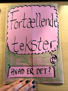 a person holding up a pink sign with words written on it that read, for allende tekster i had er det?