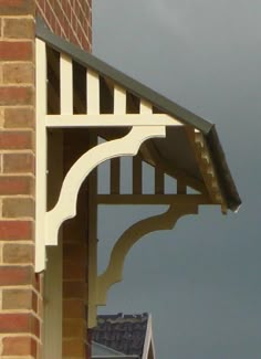 a clock on the side of a building with a sky in the backround