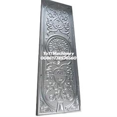 a metal plaque with an intricate design on it