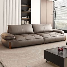 a modern living room with leather furniture and large windows overlooking the cityscape,