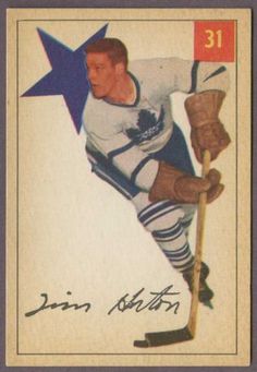 an old - fashioned hockey card with a man holding a stick