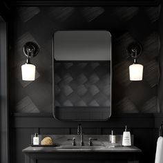 a bathroom vanity with two lights and a mirror