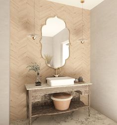 a bathroom with a sink, mirror and vase on the counter in front of it