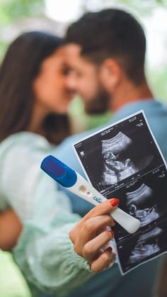 a man and woman kissing while holding an x - ray