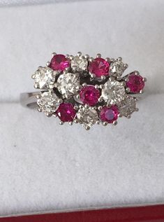 18K White Gold Ruby And Diamond Ring 6 Brilliant Cut AA quality Rubies 1ctw 8 Genuine Diamonds .88ctw SI2 clarity F Color Appraisal $8,000 Beautiful High Diamonds F color grade Rubies AA quality Gorgeous 18K Gold Ring Weighs- 5.2 grams Ring size - 7.25 Visit our shops on Etsy HauteCoutureLaLa TrendsCouture BeautifulPatina LastingTrends Combine shipping within the first three shops listedFree Shipping on orders over $35.00 however if there is a return buyer to refund seller for the free shipping White Diamond Multi-stone Cluster Ring, White Multi-stone Diamond Cluster Ring, Cluster Ruby Ring With Brilliant Cut Diamonds, Ruby Ring With Diamond Cluster And Brilliant Cut, Platinum Multi-stone Cluster Diamond Ring, Platinum Cluster Multi-stone Diamond Ring, Cluster Diamond Ruby Ring In White Gold, Diamond Cluster Ruby Ring With Diamond Accents, White Gold Cluster Ruby Ring With Diamonds