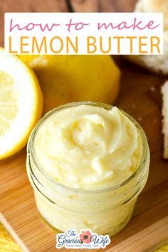 lemon butter in a glass jar next to sliced lemons and bread on a cutting board