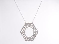 This elegant, Art Deco pendant necklace features 5.00 carats of natural diamonds in platinum. This is a necklace that truly pairs the interesting geometric shapes of the period with the fineness of the filigree work being produced at that time. Set with only old European cut diamonds, this delicate platinum & diamond necklace truly glitters from any angle. For the lover of refined and timeless Art Deco jewelry, this necklace has it all.Composition: PlatinumPrimary Stone: Genuine Natural Diam Art Deco Oval Diamond Necklaces, Art Deco Oval Diamond Necklace, Art Deco Diamond Necklace With Accents, Art Deco Silver Necklace With Single Cut Diamonds, Luxury Silver Filigree Diamond Necklace, Art Deco Necklace With Diamond Accents, Luxury Silver Diamond Filigree Necklace, Art Deco Diamond Necklace In Diamond White, Art Deco Diamond White Diamond Necklace