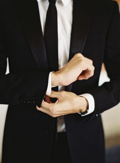 black and white photograph of a man in a tuxedo