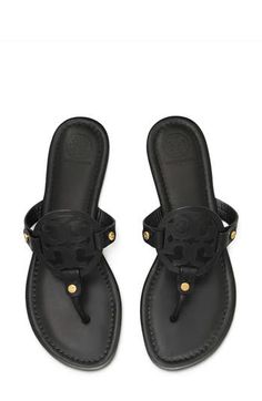 Known for its supple leather, iconic branding and lightly cushioned footbed, the original Miller sandal is a timeless favorite. Cushioned footbed Leather upper and lining/rubber sole Imported Lowmel Sneaker, Birkenstock Cannes, Tory Burch Miller Sandals Black, Ugg Lowmel, Jadon Platform Boots, Vagabond Shoemakers, Tory Burch Flip Flops, Miller Sandal, Tory Burch Sandals