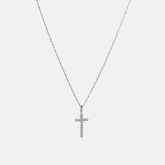 ✨ Classic Cross Pendant Necklace ✨A timeless symbol of faith and elegance, the Classic Cross Pendant Necklace is designed to add a touch of sparkle to your everyday style. Crafted from 18k gold-plated brass or sleek silver, this necklace features a delicate cross adorned with shimmering crystals. Lightweight and versatile, it’s perfect for any occasion. Why You’ll Love It: Timeless Design: A classic cross pendant with crystal accents for subtle sparkle. Premium Finish: Available in 18k gold-plat Classic Cross Clavicle Chain Necklace, Diamond Accented Crucifix Necklace For Gift, Crucifix Necklace With Diamond Accents, Crucifix Necklace With Diamond Accents Gift, Silver Necklace With Delicate Chain And Cross Pendant, Elegant Cross Charm Necklace With Adjustable Chain, Classic Cross Cubic Zirconia Necklaces, Dainty Cross Necklace In Cubic Zirconia, Classic Cross Necklace In Cubic Zirconia