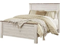 a bed with a wooden headboard and foot board