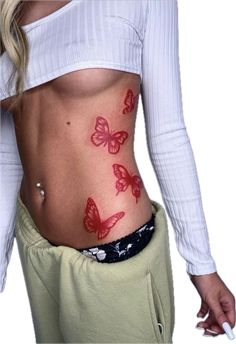 a woman with red butterflies on her stomach