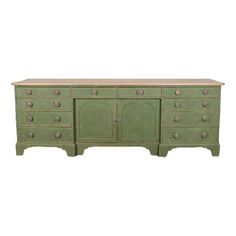 an old green dresser with many drawers and knobs on the front, against a white background