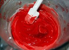 a blender filled with red food coloring