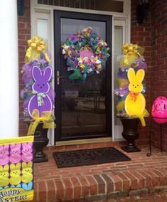 the front door is decorated with easter decorations