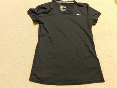 NIKE BLACK DRI-FIT TOP SHIRT SIZE MEDIUM This is used woman short sleeve dri fit shirt by Nike in very good condition , regular fit. size medium, measurements : armpit to armpit 17.5" ( circle 35"), total length : 24.5", shoulder to shoulder: 16", sleeve opening: 6.5", black color, Nike logo on left front,  100% polyester, made in Honduras, please check photos for detail.   FREE SHIPPING IS FOR US AND APO ADDRESS ONLY!!! I only ship to the address provided by Paypal. Please make sure that your i Nike Dri-fit Moisture-wicking Top, Nike Fitted Sports Shirt, Nike Dri-fit Tops For Sports Season, Nike Fitted Shirt For Sports, Nike Dri-fit Tops For Workout, Nike Dri-fit Tops For Sports, Fitted Nike Sports Shirt, Nike Sporty Moisture-wicking Shirt, Fitted Nike Shirt For Sports