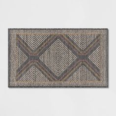 an area rug is shown in grey and brown colors