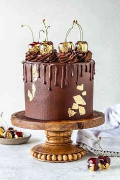 a chocolate cake with cherries on top