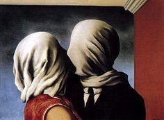 two people with heads covering each other in front of a painting