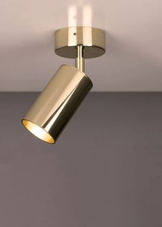 a close up of a light fixture on a ceiling with two lights in the middle