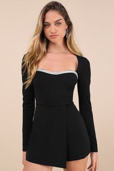 You'll make any night instantly more chic with a look like the Lulus Fashionable Sparkle Black Rhinestone Long Sleeve Skort Romper! Stretchy crepe knit shapes this skort romper with long sleeves that frame a princess-seamed bodice with a subtle sweetheart neckline, trimmed with sparkling rhinestones. High, fitted waist sits atop hidden shorts that boast a cute skirt overlay. Hidden back zipper/clasp. Fit: This garment fits true to size. Length: Above mid-thigh. Size medium measures 31" from shoulder to hem. Inseam: 2.75 Front Rise: 13.50 Bust: Great for any cup size. Waist: Fitted - very fitted at natural waist. Hip: Loosely Fitted. Undergarments: May be worn with a strapless bra, adhesive bra, petals, or no bra. Fabric: Fabric is very stretchy. Bodice and skirt are lined. Shell: 95% Polye Fitted Short Length Party Tops, Fitted Short Length Tops For Party, Elegant Mini Length Party Jumpsuits And Rompers, Elegant Mini Length Jumpsuits And Rompers For Party, Elegant Mini-length Party Jumpsuits And Rompers, Elegant Mini Length Jumpsuit For Party, Fitted Mini Jumpsuit For Night Out, Fitted Mini Length Jumpsuit For Night Out, Fitted Mini Length Jumpsuits And Rompers For Night Out