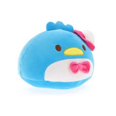 a blue stuffed animal with a bow on it's head and eyes, sitting in front of a white background