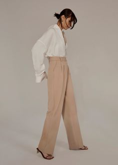 Everyone’s favorite. (Hence, the name.) These tailored, best-selling beauties have a fluid wide-leg silhouette with a high waist and front pleats. Crafted from a blend suiting fabric with front pockets and a relaxed fit, these beige trousers stand tall on their own but look especially sharp paired with the Favorite Blazer & coordinating vest.Inseam: 34"Rise: 12 3/4"69% Polyester, 26% Rayon, 5% SpandexModels are wearing size 2 and 8Inseam: 34" Chic Cream Bottoms With Pressed Crease, Wide Leg Cream Pants With Pressed Crease, Cream Wide-leg Pants With Pressed Crease, Beige Wide Leg Pants With Belt Loops, Tailored Cream Wide Leg Pants For Formal Occasions, Neutral Wide-leg Pants With Belt Loops, Chic Beige Wide Leg Dress Pants, Chic Beige Wide-leg Dress Pants, Chic Cream Wide Leg Pants For Formal Occasions