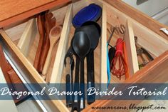 an open drawer with utensils and spoons in it that is labeled diagonal drawer binder