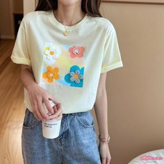 Qteee - Elegance Stitched Round Neck Loose T-Shirt with Floral Embroidery Casual Yellow Embroidered T-shirt, White Crew Neck T-shirt With Floral Applique, Casual Yellow T-shirt With Embroidered Graphics, Casual Yellow Tops With Embroidered Graphics, Trendy Embroidered T-shirt For Summer, Trendy Embroidered Graphics T-shirt, Yellow Cotton Top With Embroidered Graphics, Casual Yellow Top With Floral Embroidery, White Short Sleeve T-shirt With Floral Applique