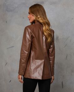 Make a statement this season with effortless, elevated style in the Edgy Feeling Faux Leather Blazer. This standout piece features smooth faux leather with a singular front button closure and padded shoulders, exuding confidence and structure effortlessly. Perfect for layering over cozy knits or sleek turtlenecks, this blazer is your go-to for embracing autumn with a chic, edgy twist. Smooth faux leather fabric Singular front button closure Padded shoulders Front flap pockets Buttoned cuffs Back vent Shell : 55% Polyester 45% Polyurethane Lining : 100% Polyester Sleek Faux Leather Winter Blazer, Sleek Semi-formal Leather Blazer, Long Sleeve Faux Leather Blazer With Button Closure, Brown Leather Button-up Blazer, Fall Single-breasted Faux Leather Blazer, Faux Leather Blazer, Western Wear Dresses, Elevated Style, Sleeveless Cardigan