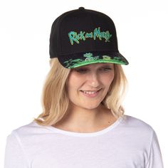 This is an Rick And Morty hat. This Rick and Morty baseball cap is great for any fan of the highly offensive yet hilarious cartoon! Each of these Rick and Morty hats showcases a raised embroidered Rick and Mort logo on the front of the crown. The pre-curved bill has a detailed character pattern of Rick and Morty standing in a portal, ready to go do some damage somewhere in the universe! The Rick and Morty hat has an adjustable snapback closure for a tremendous one-size-fits-most design. Make thi Adjustable Fitted Baseball Cap For Fans, Novelty Baseball Cap With Adjustable Curved Brim, Adjustable Dad Hat With Curved Brim For Fans, Novelty Adjustable Baseball Cap With Curved Brim, Adjustable Baseball Cap For Fan Merchandise, Adjustable Snapback Baseball Cap For Fans, Novelty Hats With Adjustable Curved Bill, Novelty Baseball Cap With Flat Bill And Adjustable Fit, Hip Hop Style Baseball Cap For Fan Merchandise