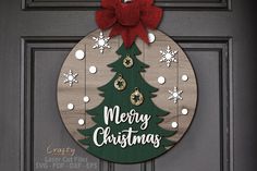 a wooden christmas ornament hanging on a door