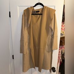 Never Worn. Suede. Perfect Condition. Belt To Tie To Close It Chic Camel Outerwear With Pockets, Chic Taupe Outerwear With Pockets, Spring Camel Long Coat, Camel Long Coat For Spring, Hooded Brown Outerwear For Work, Brown Hooded Outerwear For Work, Long Camel Coat For Spring, Casual Long Camel Coat, Chic Brown Open Front Outerwear