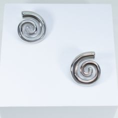 embrace your inner fashionista with our exquisite Nautilus Earrings. make a statement with these conversation-starting earrings that exude luxury and sophistication. instantly take any look from simple to expertly styled. 18k gold or rhodium pvd over 316 stainless steel water & tarnish resistant 29mm long 4mm thick post back Modern Spiral Earrings For Formal Occasions, Spiral Earrings For Formal Occasions, Modern Metal Plug Earrings For Formal Wear, Elegant Hypoallergenic Metal Plug Earrings, Modern Pierced Plug Earrings For Formal Occasions, Trendy Nickel Free Earrings For Formal Occasions, Sterling Silver Spiral Earrings For Formal Occasions, Elegant Spiral Hypoallergenic Hoop Earrings, Elegant White Gold Spiral Earrings